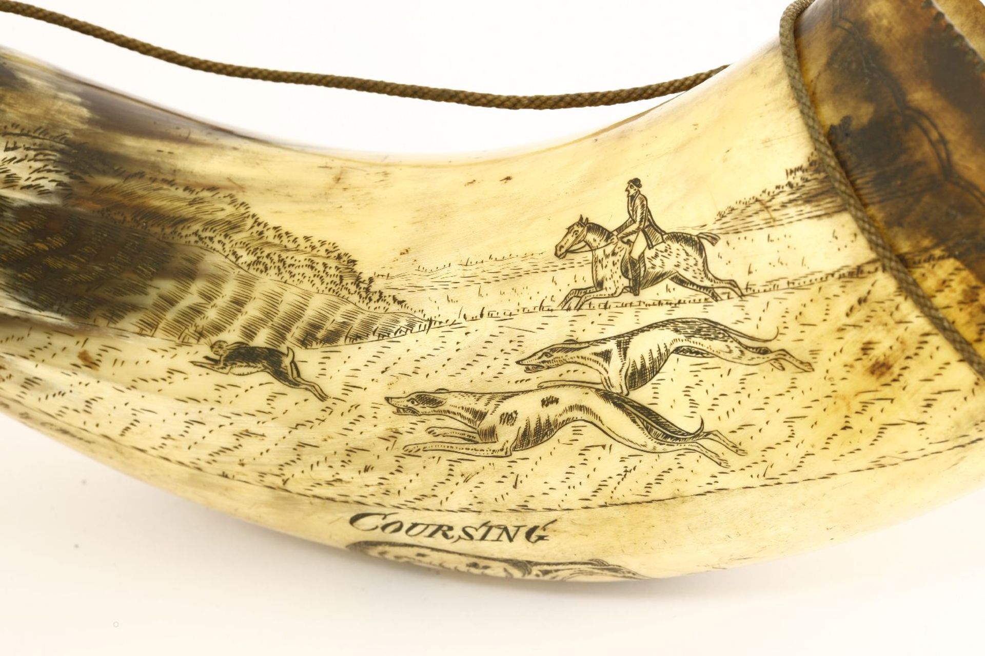 A scrimshaw hunting horn,mid-19th century, depicting hare coursing scenes, and inscribed 'From an - Image 4 of 4