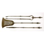 A set of three George III polished steel fire irons, rwith leaf-engraved finials and stems,shovel