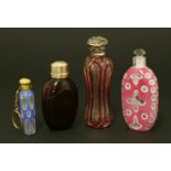 Four Victorian scent bottles,hallmarks indistinct,a faceted and flash-dipped waisted body below a