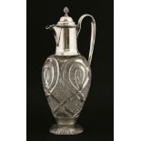 A Victorian silver claret jug,Favell, Elliott & Co., London 1887,with a cut-glass ovoid body,28.