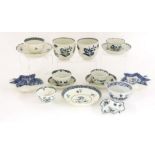 A collection of first period Worcester blue and white tea bowls and saucers,a teacup and saucer, a