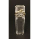 An unusual clear glass scent bottle,late 19th century, of tapering rectangular shape with canted