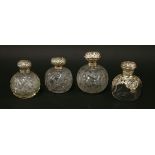 Two cut-glass silver cologne bottles,with silver covers,Birmingham 1902 and Chester 1906,13 and 15cm