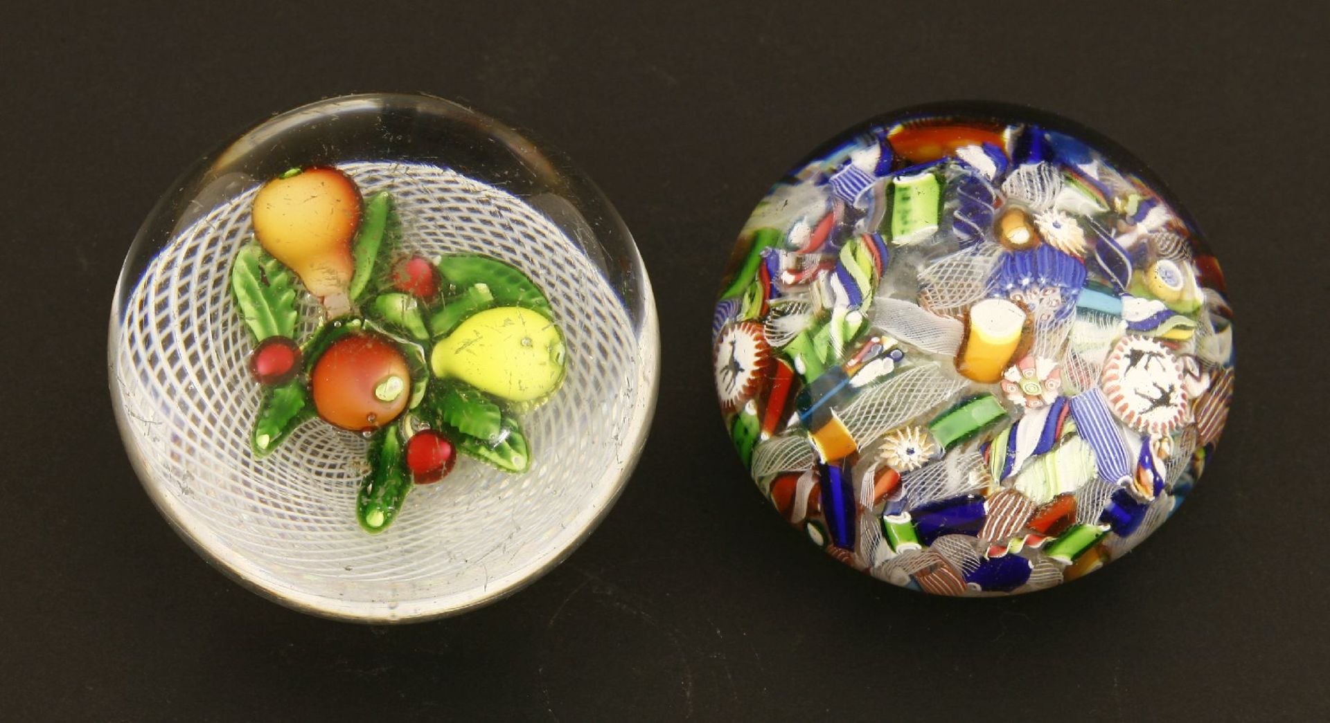 Two St Louis paperweights,one mid-19th century, with fruit on a latticino ground,6.5cm,one scrambled