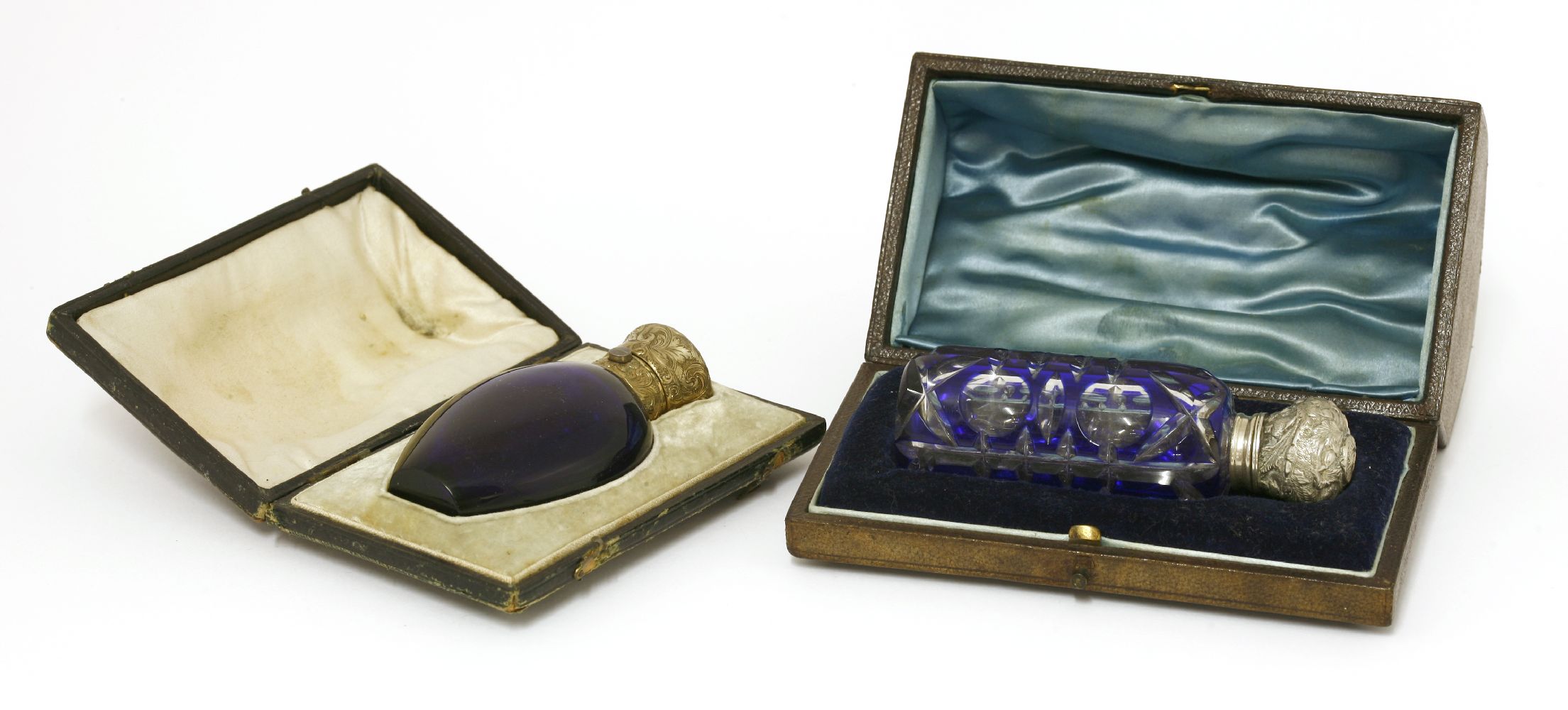 A Victorian cased blue glass scent bottle,of teardrop shape with an engraved gilt metal hinged