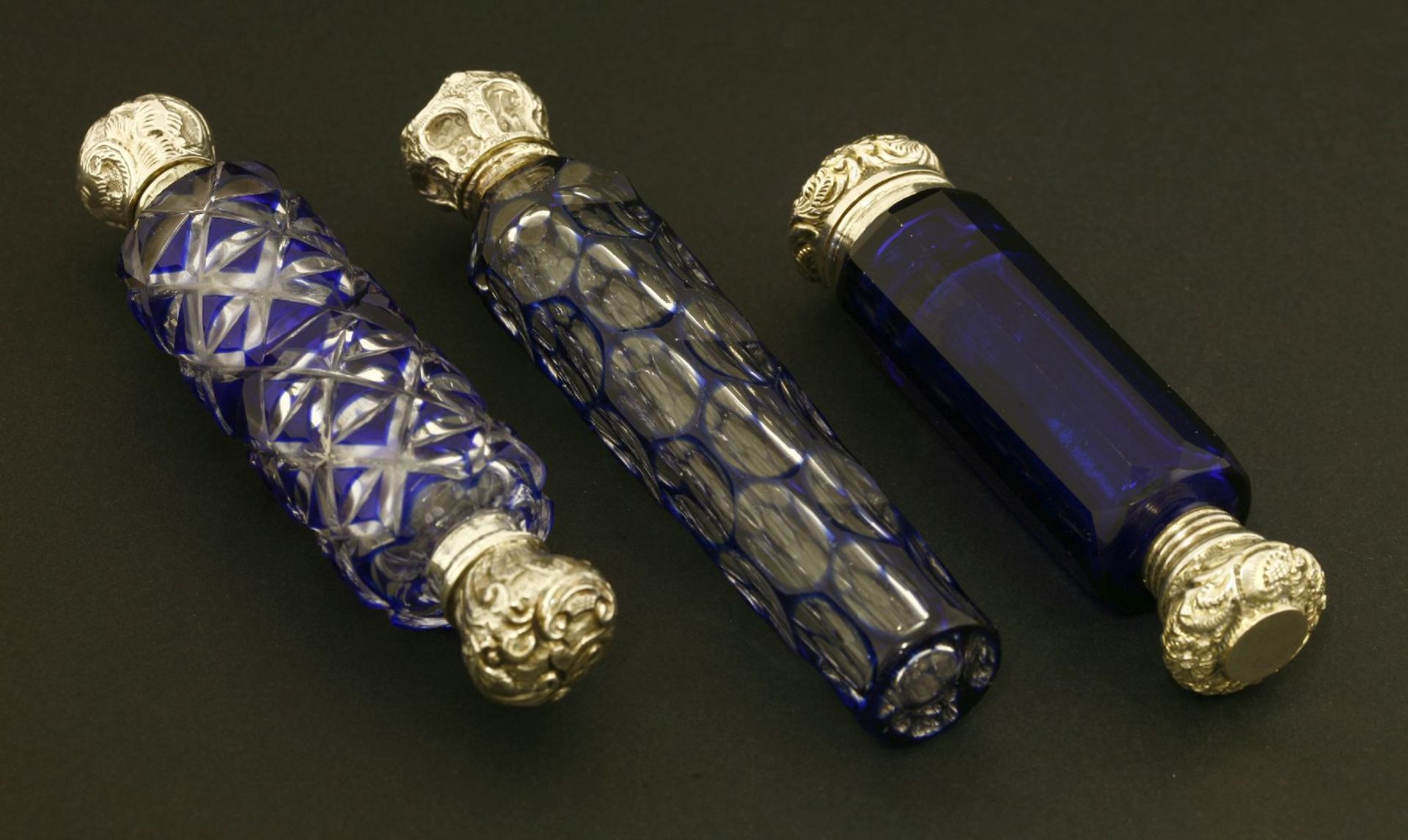 Two double-ended scent bottles,one with blue and cut decoration, one blue glass with a