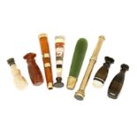 Five agate handled desk seals,longest 6.5cm,an amber cigarette holder,with 9ct mounts,a Sampson