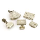 Five silver vinaigrettes:Birmingham 1818,of satchel shape with engraved decoration,3.7cm.