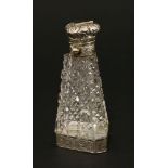 A Victorian scent bottle,of tapering triangular form with hobnail cut decoration, the hinged cover