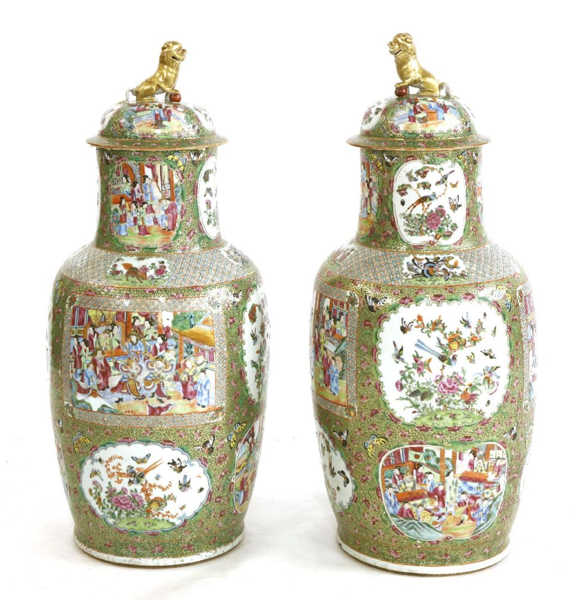 A pair of Canton vases and covers,19th century, each decorated with panels of figures, and