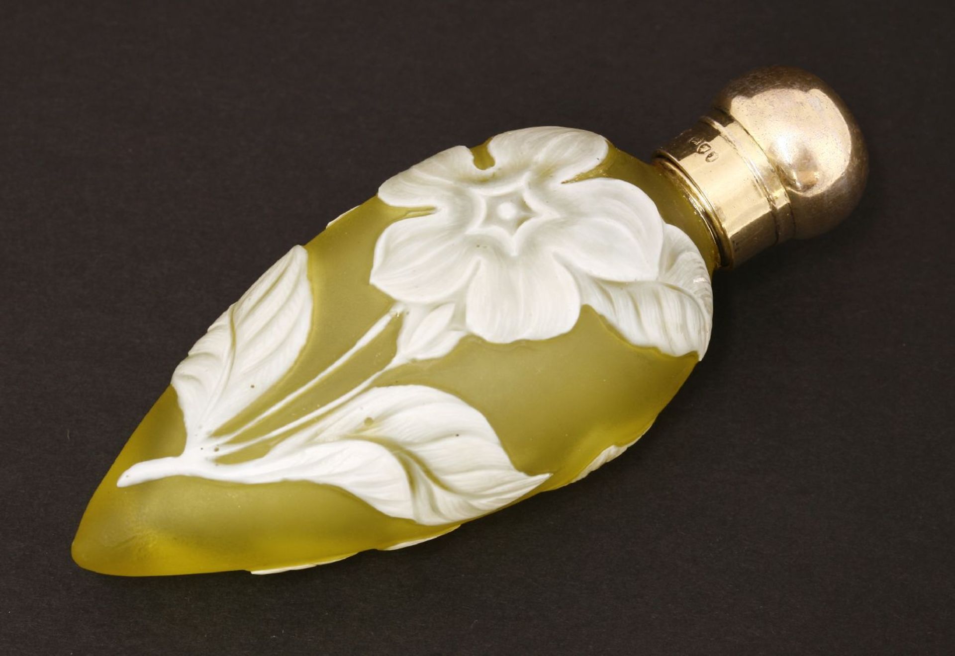 A cameo glass scent bottle,by Thomas Webb & Co, Stourbridge, the yellow glass of teardrop shape