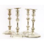 A set of four silver candlesticks, by Hawksworth, Eyre & Co., Birmingham 1901, with detachable