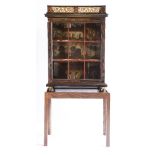 A Continental ebony and red tortoiseshell glazed display cabinet, r18th century, having a cast metal