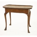 A George I walnut tray top table,with a frieze drawer, candle slides and scrolled legs,78.5cm