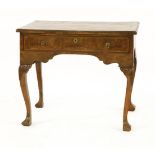 A walnut side table,mid-18th century, with a single drawer raised on cabriole legs,84.5cm wide 52.
