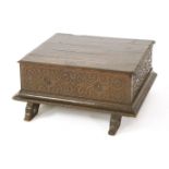 An early oak boarded box,c.1580, the moulded top over carved strapwork panels with flower heads,