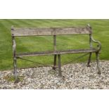 A cast iron garden bench,with naturalistic branch ends and slatted seat,154cm wide