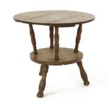 An oak two-tier cricket table, 18th century, probably Cornish, 69.5cm diameter62.5cm high