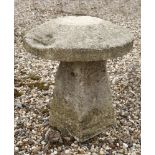 A staddle stone,in two parts,65cm high