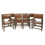 A set of eight Spanish oak dining chairs,18th century, the square backs and seats upholstered in