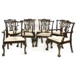 A set of eight Chippendale-style mahogany dining chairs, the shaped top rails with carved bell