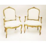 A pair of Louis XV giltwood fauteuils,after Jean-Baptiste Tilliard, each with a carved foliate