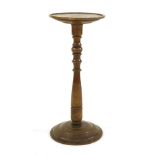 An elm candle stand,18th century, 31cm diameter71cm high