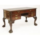A mahogany writing table,mid-18th century and later, in the manner of Otto Channon, the tooled