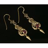 A pair of Victorian gold garnet drop earrings,on replacement hook fittings. An oval mixed cut