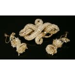 A seed pearl matched brooch and earrings suite, c.1830,with a knot-style brooch, composed of rows of