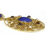 A Victorian, lapis lazuli, garnet and split pearl gold pendant,by John Brogden. The open oval form
