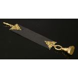 A late Victorian gold-mounted ribbon fob,with a 9ct gold late Edwardian seal to one end, suspended