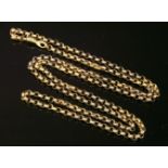 A Regency gold guard chain,with emerald set hand clasp, composed of a chevron textured belcher