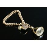 An Edwardian 9ct gold curb chain bracelet,with a large padlock clasp, hand engraved to the