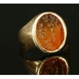 A gentlemen's mid to late 20th century gold intaglio signet ring,with an oval cornelian intaglio,
