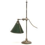 A silvered table lamp, the adjustable swing arm fitted with a green shade, 49cm high