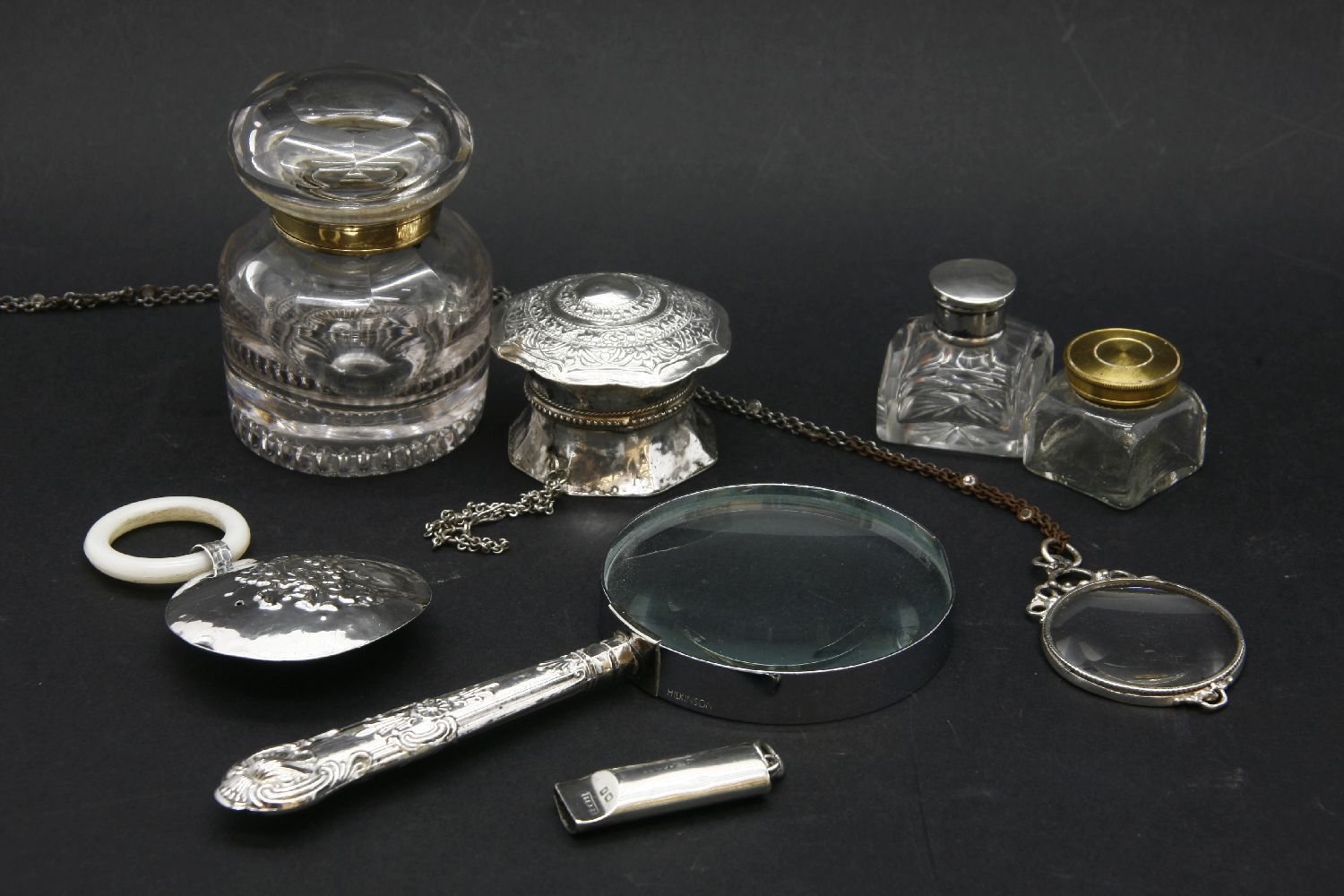 An Edwardian silver baby's rattle, a silver magnifying glass and other collectables (quantity)