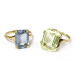 A 9ct gold single stone step cut green synthetic spinel ring, and another similar step cut blue