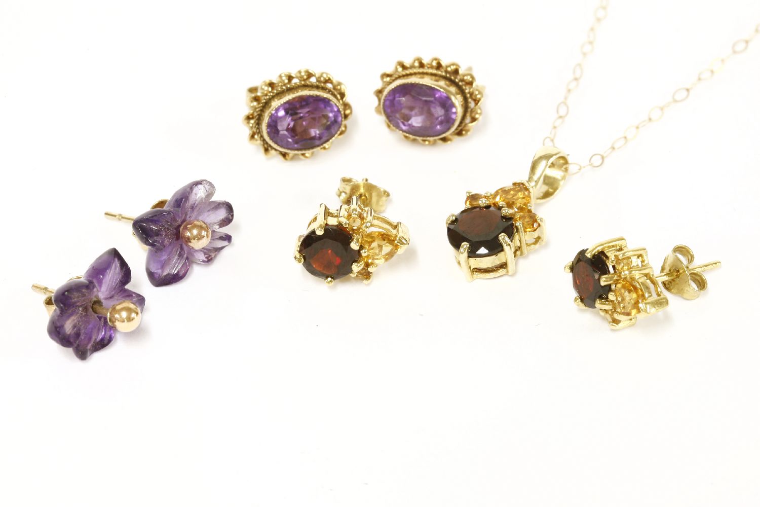 Three pairs of assorted earrings, to include a pair of 9ct gold citrine and garnet cluster