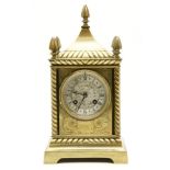 A late 19th century French brass mantel clock, in the gothic style, the movement stamped 'S.