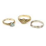 A gold single stone zircon ring marked 9ct, a 9ct gold single stone illusion set diamond ring with