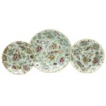 Three Chinese famille rose plates, with green grounds, largest 25cm diameter