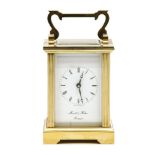 A modern brass carriage clock, the white dial marked 'Morrell & Hilton, Huntingdon', 14cm high to