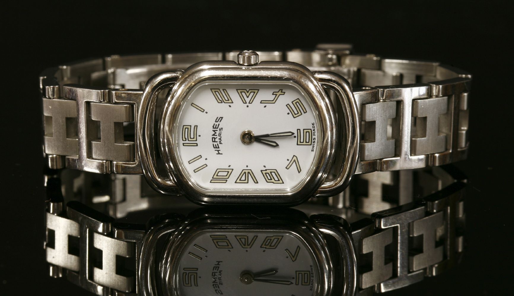 A ladies' stainless steel Hermès Rallye Quartz bracelet watch, model no. RA1.210. A white enamel