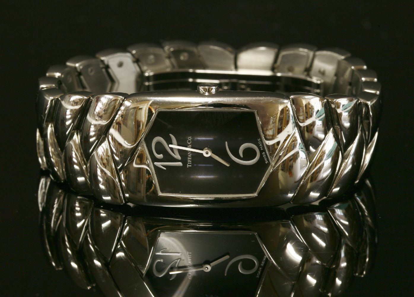 A ladies' stainless steel Tiffany Tesoro quartz bracelet watch,with a black hexagonal dial, silver