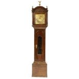 A George III oak longcase clock, by Thomas Page, Bishops Stortford having a brass arched dial with