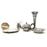 A box of silver plated items, including cutlery, a teapot, and a vase