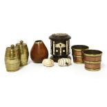 A cylindrical ebony money box, late 19th century, with ivory mounts, two miniature brass barrels and