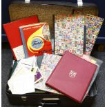 A large suitcase with a large quantity of stamps, to include five albums of Railway Heritage stamps,