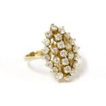 A gold diamond simulant lozenge shaped cluster ring, (tested as approximately 14ct gold), size P½4.